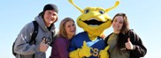 Mascot Sammy the Slug with students